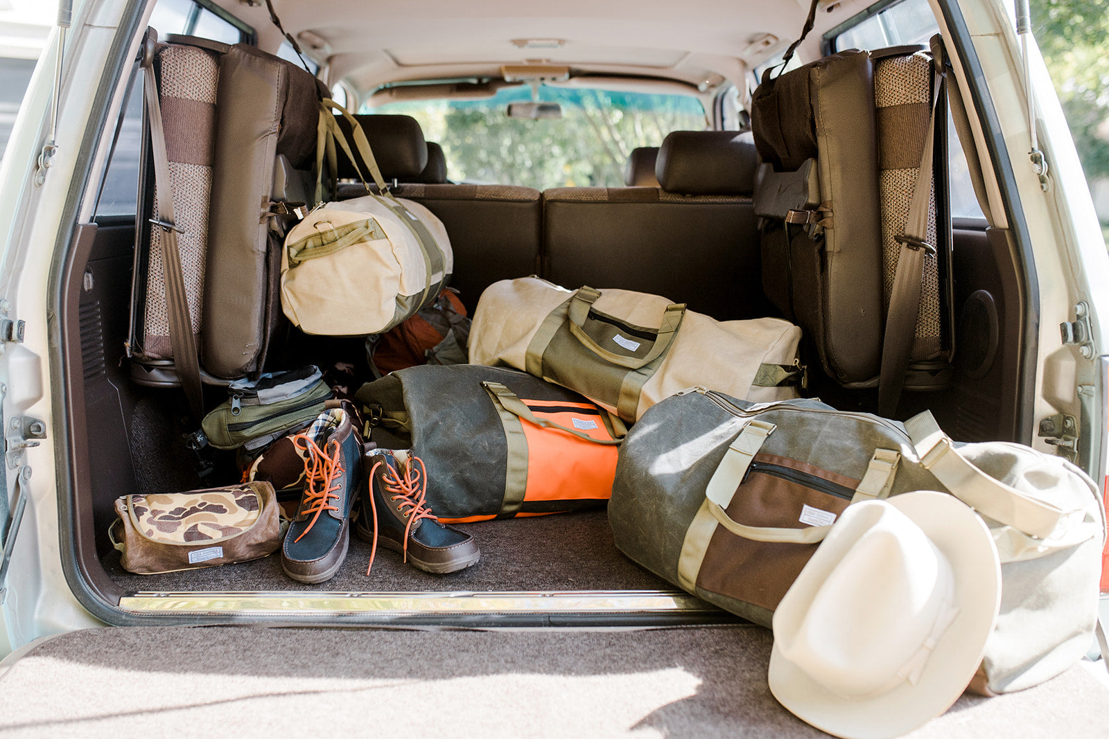 Best waxed canvas luggage, made in America bags, vintage baggage, military duffels, vintage dopp kit, 48 hour duffel, Zilker belts collab, canvas tote bag.